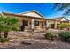 Landscaped backyard with covered patio at 18478 N Canal Dr, Surprise, AZ 85374