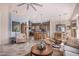 Open concept living room, kitchen, and dining area with tile floors at 18478 N Canal Dr, Surprise, AZ 85374