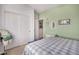 Charming guest bedroom with white closet doors and a comfortable bed at 18478 N Canal Dr, Surprise, AZ 85374