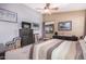Large bedroom with striped bedding and ample closet space at 18478 N Canal Dr, Surprise, AZ 85374