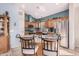 Modern kitchen with granite countertops and wood cabinets at 18478 N Canal Dr, Surprise, AZ 85374