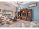 Spacious living room featuring a large entertainment center and comfortable seating at 18478 N Canal Dr, Surprise, AZ 85374
