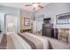 Bright bedroom featuring a comfortable bed, large window, and built-in dresser at 18478 N Canal Dr, Surprise, AZ 85374