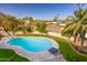 Inviting kidney-shaped pool with surrounding patio and lounge chairs at 10647 N 82Nd Pl, Scottsdale, AZ 85260