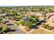 Aerial view of single-story home with pool and lush landscaping at 10647 N 82Nd Pl, Scottsdale, AZ 85260