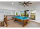 Game room with pool table and access to balcony overlooking backyard at 10647 N 82Nd Pl, Scottsdale, AZ 85260