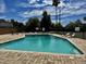 Community swimming pool with lounge chairs and patio area at 925 S Acapulco Ln # C, Tempe, AZ 85281