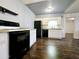 Modern kitchen with white cabinets, black appliances, and dark floors at 1440 N Idaho Rd # 2041, Apache Junction, AZ 85119