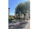Side view of condo building with landscaping and walkway at 1440 N Idaho Rd # 2041, Apache Junction, AZ 85119