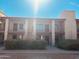 Front view of a two-story building with multiple units and a staircase at 1440 N Idaho Rd # 2041, Apache Junction, AZ 85119
