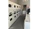 Well-equipped laundry room with multiple washers and dryers at 1440 N Idaho Rd # 2041, Apache Junction, AZ 85119