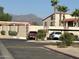 Parking area with mountain view and some parked vehicles at 1440 N Idaho Rd # 2041, Apache Junction, AZ 85119