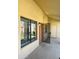 View of condo building's entrance with security door and window at 1440 N Idaho Rd # 2041, Apache Junction, AZ 85119