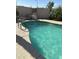 Inviting kidney-shaped pool with patio seating at 1440 N Idaho Rd # 2041, Apache Junction, AZ 85119