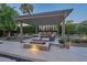 Outdoor patio area with pergola, fire pit and seating area at 2200 E Aquarius Pl, Chandler, AZ 85249