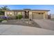 Luxury home exterior with stone accents and landscaping at 2200 E Aquarius Pl, Chandler, AZ 85249