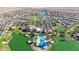 Aerial view of community with lake, pool, clubhouse, and numerous homes at 16914 S 180Th Ave, Goodyear, AZ 85338