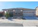 Single-story home with two-car garage and landscaping at 16914 S 180Th Ave, Goodyear, AZ 85338