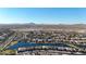 Community overview showcasing lake, homes, and desert landscape at 16914 S 180Th Ave, Goodyear, AZ 85338