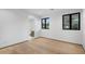 Simple bedroom with hardwood floors and an ensuite bathroom at 5525 E Lincoln Dr # 124, Paradise Valley, AZ 85253