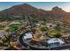 Aerial view showcasing a home community with golf course and mountain views at 5525 E Lincoln Dr # 124, Paradise Valley, AZ 85253