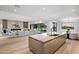 Open concept kitchen with large island, modern cabinetry, and high-end appliances at 5525 E Lincoln Dr # 124, Paradise Valley, AZ 85253