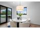 Bright breakfast nook with a round table and chairs, offering scenic views at 5525 E Lincoln Dr # 124, Paradise Valley, AZ 85253