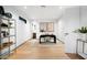 Spacious home office with hardwood floors and built-in shelving at 5525 E Lincoln Dr # 124, Paradise Valley, AZ 85253