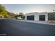 View of the home's garage and driveway at 5525 E Lincoln Dr # 124, Paradise Valley, AZ 85253
