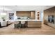 Modern kitchen with large island, hardwood floors, and high-end appliances at 5525 E Lincoln Dr # 124, Paradise Valley, AZ 85253