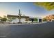 Modern home with white stucco and a two-car garage at 5525 E Lincoln Dr # 124, Paradise Valley, AZ 85253