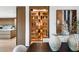 Custom wet bar with glass-front cabinetry and ample storage at 5525 E Lincoln Dr # 124, Paradise Valley, AZ 85253
