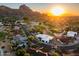 Aerial view of a luxury home community near a golf course and mountains at 5525 E Lincoln Dr # 124, Paradise Valley, AZ 85253
