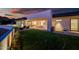 Modern home with backyard patio and lawn, offering outdoor entertaining space at 5525 E Lincoln Dr # 124, Paradise Valley, AZ 85253