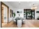 Elegant dining room with a long table, modern chairs, and access to a patio at 5525 E Lincoln Dr # 124, Paradise Valley, AZ 85253
