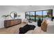 Main bedroom with a king-size bed and stunning views from sliding glass doors at 5525 E Lincoln Dr # 124, Paradise Valley, AZ 85253