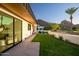 Spacious backyard with grassy lawn, patio, and mountain backdrop at 5525 E Lincoln Dr # 124, Paradise Valley, AZ 85253