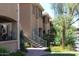 Building exterior showcasing Spanish-style architecture and landscaping at 16013 S Desert Foothills Pkwy # 1101, Phoenix, AZ 85048