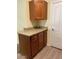 Small kitchen with wood cabinets and granite countertops at 16013 S Desert Foothills Pkwy # 1101, Phoenix, AZ 85048