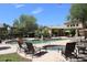 Community pool and spa with lounge chairs at 16013 S Desert Foothills Pkwy # 1101, Phoenix, AZ 85048