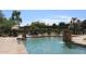 Inviting community pool with a waterfall feature and lounge chairs at 16013 S Desert Foothills Pkwy # 1101, Phoenix, AZ 85048