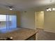 Open living room with sliding glass door leading to patio at 16013 S Desert Foothills Pkwy # 1101, Phoenix, AZ 85048