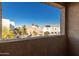 View of the community from a window, showcasing other homes and landscaping at 2260 W Harmont Dr, Phoenix, AZ 85021