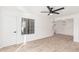 Bright living room with wood-look floors, a ceiling fan, and access to a dining area at 839 S Westwood -- # 182, Mesa, AZ 85210
