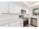 Modern kitchen with white shaker cabinets and new appliances at 839 S Westwood -- # 182, Mesa, AZ 85210