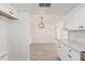 Bright dining area with light wood floors and modern chandelier at 839 S Westwood -- # 182, Mesa, AZ 85210