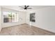 Living room showcasing wood-look flooring, a ceiling fan, and neutral walls at 839 S Westwood -- # 182, Mesa, AZ 85210