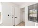 Bright entryway with white door, coat closet, and wood-look flooring at 839 S Westwood -- # 182, Mesa, AZ 85210