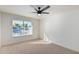 Spacious bedroom with ceiling fan, window, and neutral carpet at 839 S Westwood -- # 182, Mesa, AZ 85210