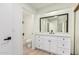 Modern bathroom with white vanity, black fixtures, and a mirror at 839 S Westwood -- # 182, Mesa, AZ 85210